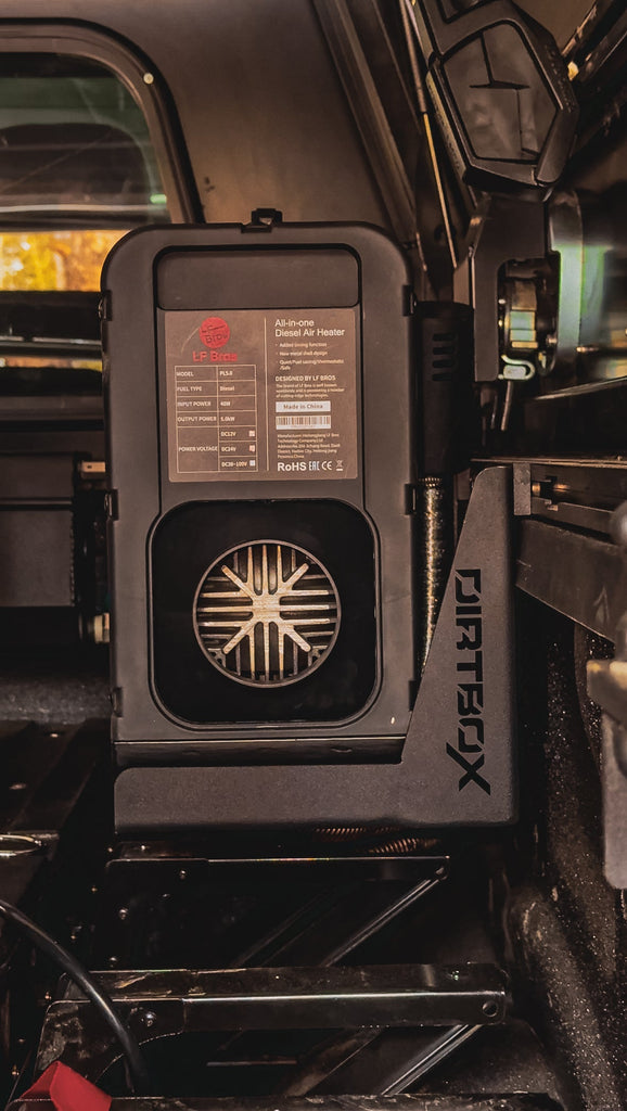 Mounted LF Bros Diesel Air Heater inside a truck by Dirtbox Overland, showcasing a secure installation in an outdoor setting.