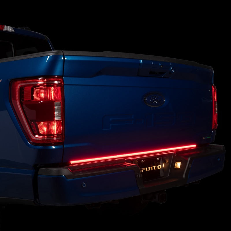 Putco 21-22 Ford F-150 60in Red Light Blade Direct Fit Kit Red/White installed on a blue Ford F-150 tailgate, showcasing industry-leading brightness.