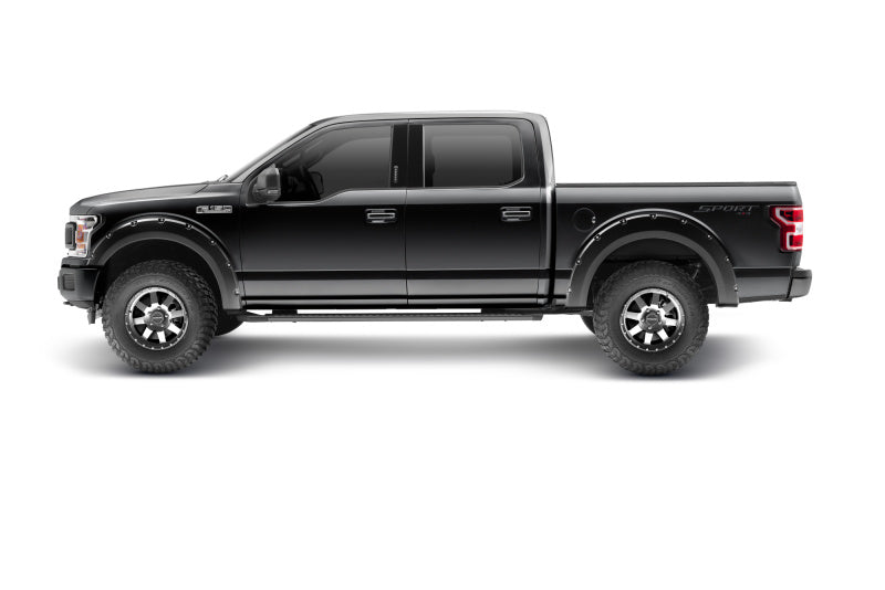 Side view of a Ford F-150 equipped with Bushwacker Pocket Style Flares in Agate Black Met, demonstrating stylish fit and function.