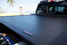 Load image into Gallery viewer, Roll-N-Lock 2019 Chevy Silverado 1500 77-3/4in E-Series Retractable Tonneau Cover