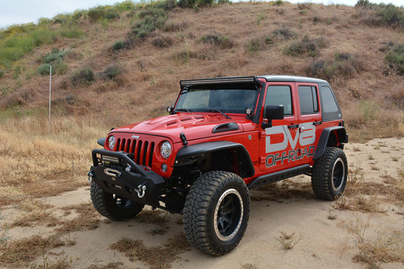 DV8 Offroad red Jeep Wrangler JK parked on a sandy area with Metal Heat Dispersion Hood.