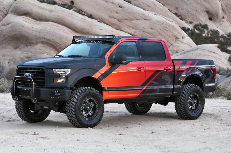 Fabtech-equipped 2015-2020 Ford F150 4WD with a striking two-tone color scheme, highlighting enhanced off-road capabilities and aggressive styling.
