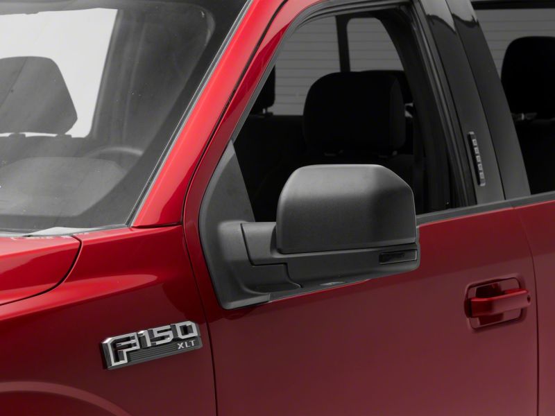Close-up view of the Raxiom Axial Series LED Mirror Mounted Turn Signals installed on a red 2015-2020 Ford F-150, showcasing its stylish and modern appearance.