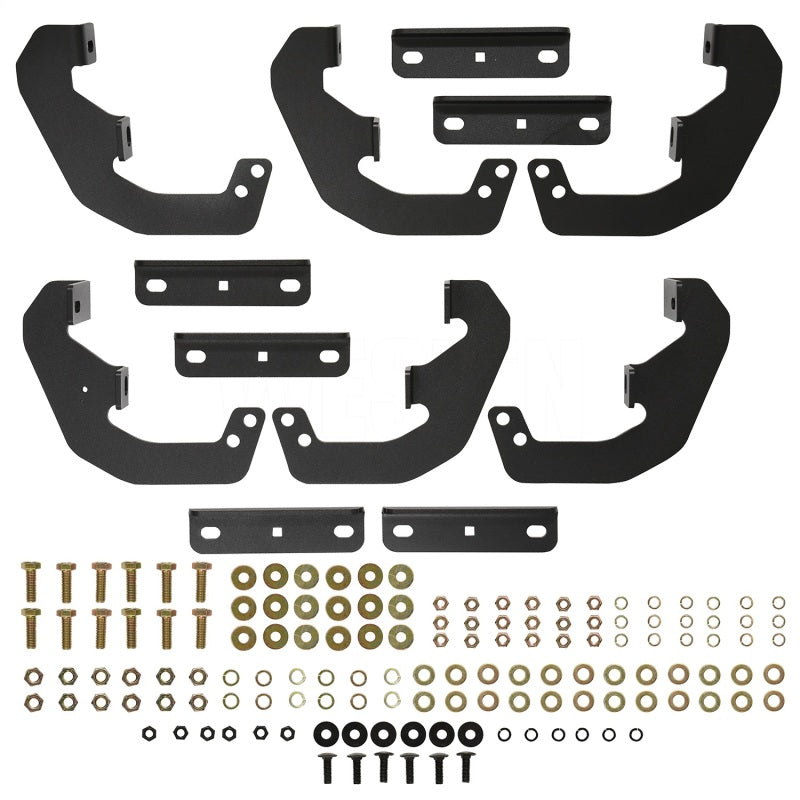Westin Outlaw Nerf Step Bars installation kit, featuring black metal brackets and assorted hardware for easy setup.