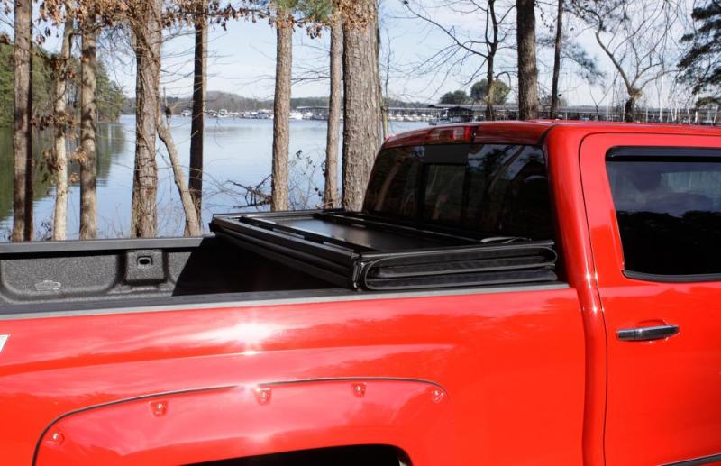 Lund 15-18 Ford F-150 Styleside (5.5ft. Bed) Hard Fold Tonneau Cover - Black