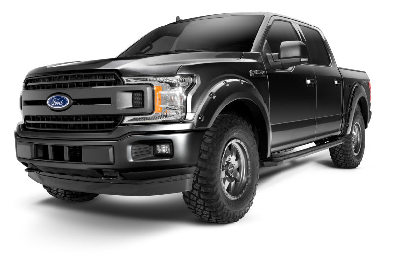 Bushwacker Pocket Style Flares for 2018-2020 Ford F-150 in Agate Black Met on a rugged truck showcasing enhanced tire coverage and bold design.