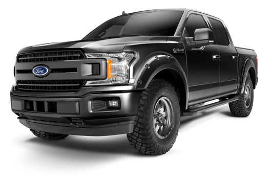 Bushwacker Pocket Style Flares for 2018-2020 Ford F-150 in Agate Black Met on a rugged truck showcasing enhanced tire coverage and bold design.
