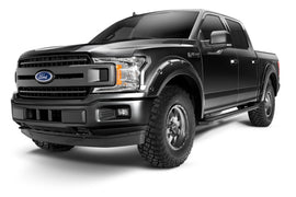Bushwacker Pocket Style Flares for 2018-2020 Ford F-150 in Agate Black Met on a rugged truck showcasing enhanced tire coverage and bold design.