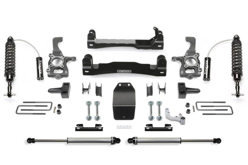 Fabtech 4in Performance System for 2015-2020 Ford F150 4WD, including Dirt Logic 2.5 Coilover front shocks, various brackets, and mounting hardware.