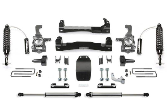 Fabtech 4in Performance System for 2015-2020 Ford F150 4WD, including Dirt Logic 2.5 Coilover front shocks, various brackets, and mounting hardware.