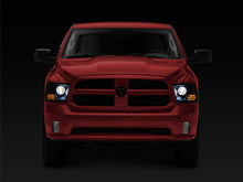 Load image into Gallery viewer, Raxiom 09-18 RAM 1500 Super White LED Halo Projector Headlights- Black Housing (Clear Lens)