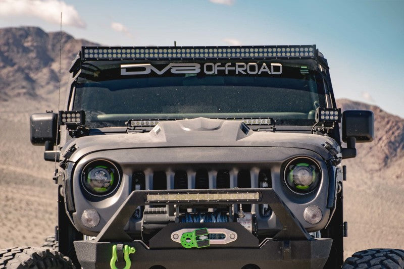 In-action shot of a black Jeep Wrangler JK by DV8 Offroad showcasing the Metal Heat Dispersion Hood.