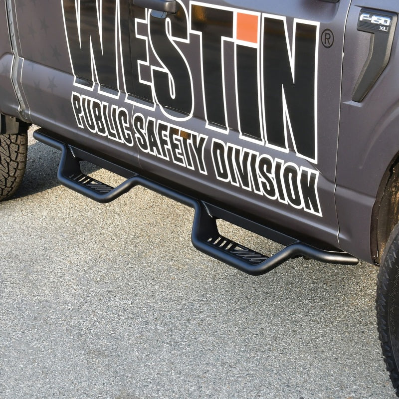 Close-up of Westin's Outlaw Nerf Step Bars installed on a Ford truck, emphasizing durability and functionality.