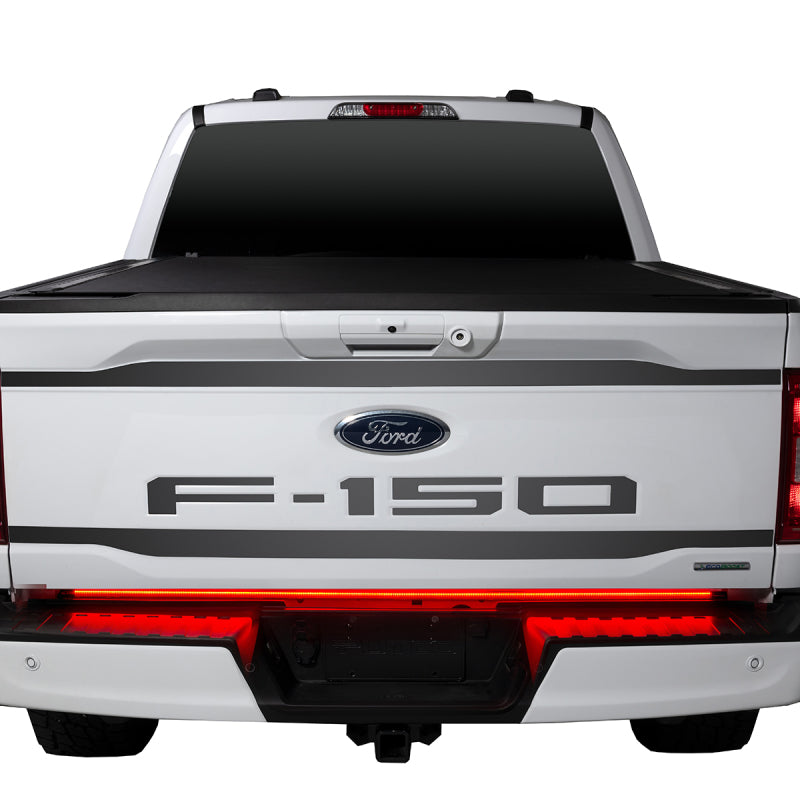 White Ford F-150 with the Putco 21-22 F-150 60in Red Light Blade Direct Fit Kit Red/White installed, highlighting the sleek tailgate and bright LED light bar.