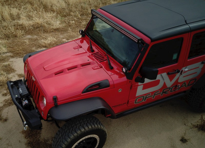Close-up of bright green accessories on a DV8 Offroad Jeep Wrangler JK featuring the Metal Heat Dispersion Hood.