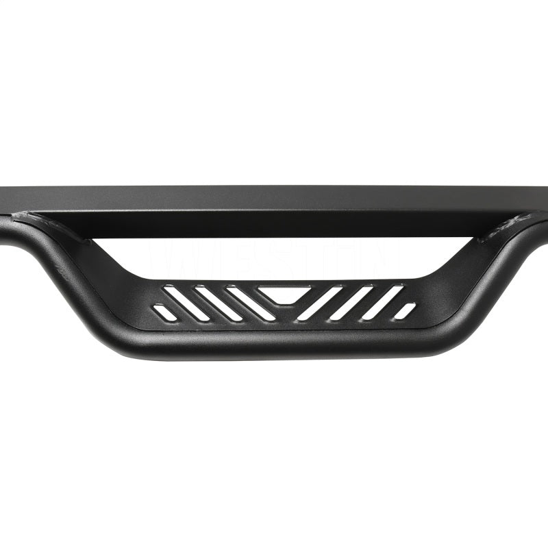 Sleek design of Westin Outlaw Nerf Step Bar including the patterned step plate for enhanced grip and style.