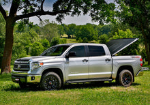 Load image into Gallery viewer, UnderCover 05-15 Toyota Tacoma 5ft SE Bed Cover - Black Textured (Req Factory Deck Rails)