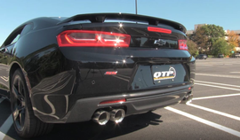 Stylish rear view of a 2016-2024 Chevrolet Camaro SS with QTP Screamer Axle Back exhaust and 4-inch quad tips, showcasing sleek design.