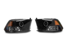 Load image into Gallery viewer, Raxiom 09-18 RAM 1500 Super White LED Halo Projector Headlights- Black Housing (Clear Lens)