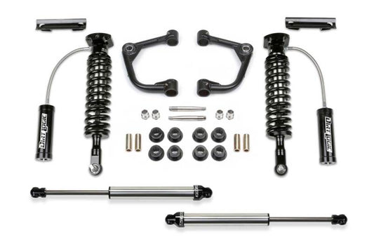 Fabtech 15-20 Ford F150 4WD 2in Uniball UCA System featuring Dirt Logic coilovers, upper control arms, and shock components, designed for off-road performance and enhanced durability.