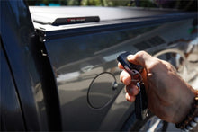 Load image into Gallery viewer, Roll-N-Lock 15-17 Chevy Silverado/Sierra 2500/3500 77-3/8in E-Series Retractable Tonneau Cover