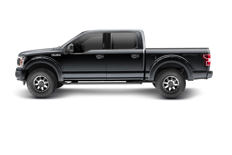 Profile view of a Ford F-150 truck equipped with Bushwacker 18-19 Pocket Style Fender Flares in sleek Shadow Black.