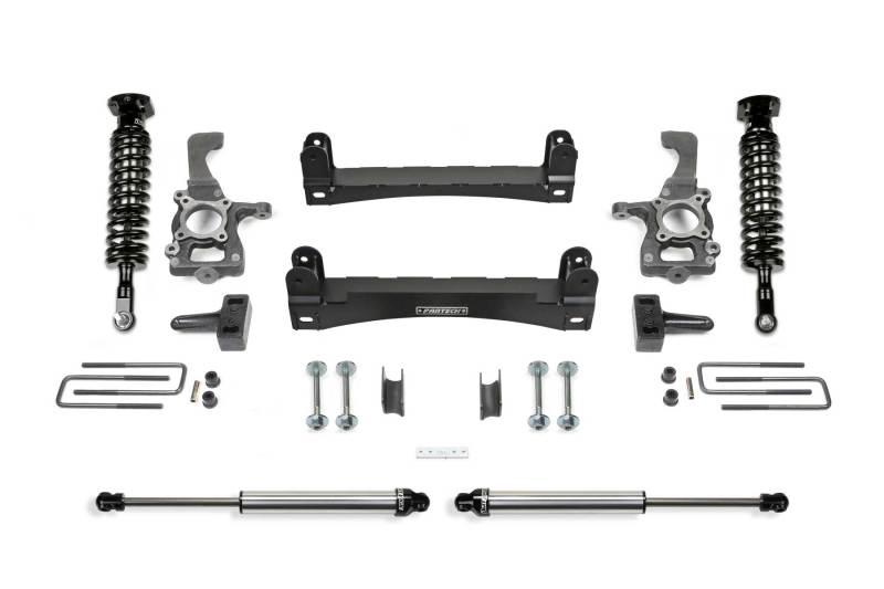 Fabtech 4-inch Performance System components for 2015-2020 Ford F-150 2WD, showcasing high-quality suspension parts including shocks, control arms, and steering knuckles.