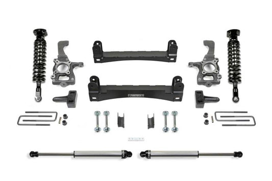 Fabtech 4-inch Performance System components for 2015-2020 Ford F-150 2WD, showcasing high-quality suspension parts including shocks, control arms, and steering knuckles.
