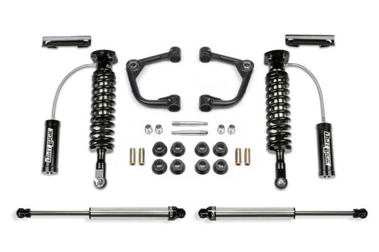 Fabtech 2WD 2-inch Uniball Upper Control Arm System for 2015-2020 Ford F150 including Dirt Logic shocks and components featured in an organized layout.
