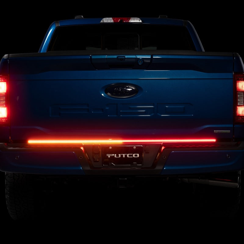 Stylish Ford F-150 featuring Putco 21-22 60in Light Blade Direct Fit Kit Red/Amber/White with vibrant LED lights illuminating the tailgate.
