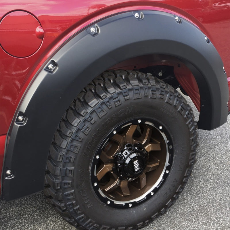 Detailed view of Bushwacker Pocket Style Flares in Agate Black Met on a Ford F-150 showcasing the rugged design and customization.