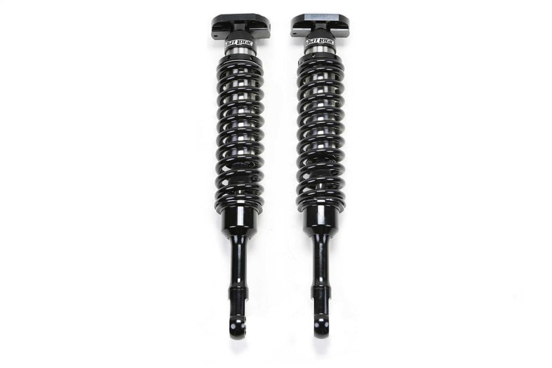 Fabtech 2021+ Ford F150 4WD 4in Front Dirt Logic 2.5 N/R Coilovers - Pair featuring durable black coilover shocks for enhanced off-road performance.