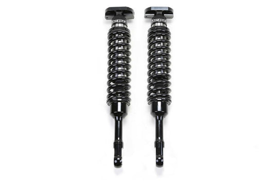 Fabtech 2021+ Ford F150 4WD 4in Front Dirt Logic 2.5 N/R Coilovers - Pair featuring durable black coilover shocks for enhanced off-road performance.