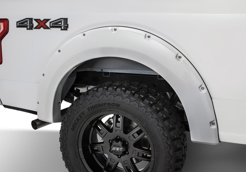 Bushwacker 18-19 Ford F-150 Pocket Style Flares: Rear fender display highlighting the durable finish and tire coverage on a Ford F-150.