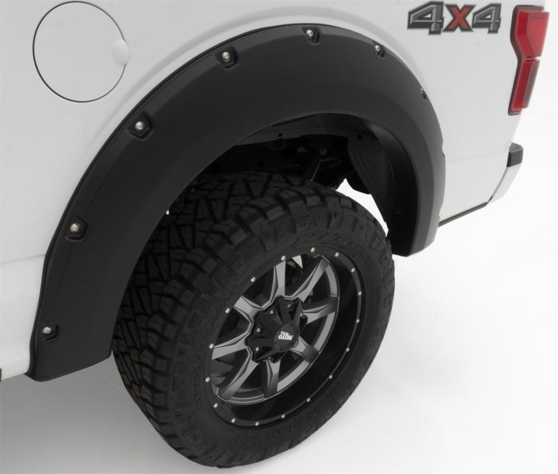 Bushwacker 18-19 Ford F-150 Pocket Style Flares: Detailed side shot of rear fender flare, showing Oxford White color and wheel design.