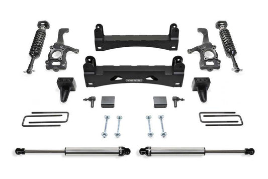 Fabtech 15-20 Ford F150 2WD 6in Performance System parts laid out, showcasing components like coilovers, crossmembers, and hardware for easy installation.