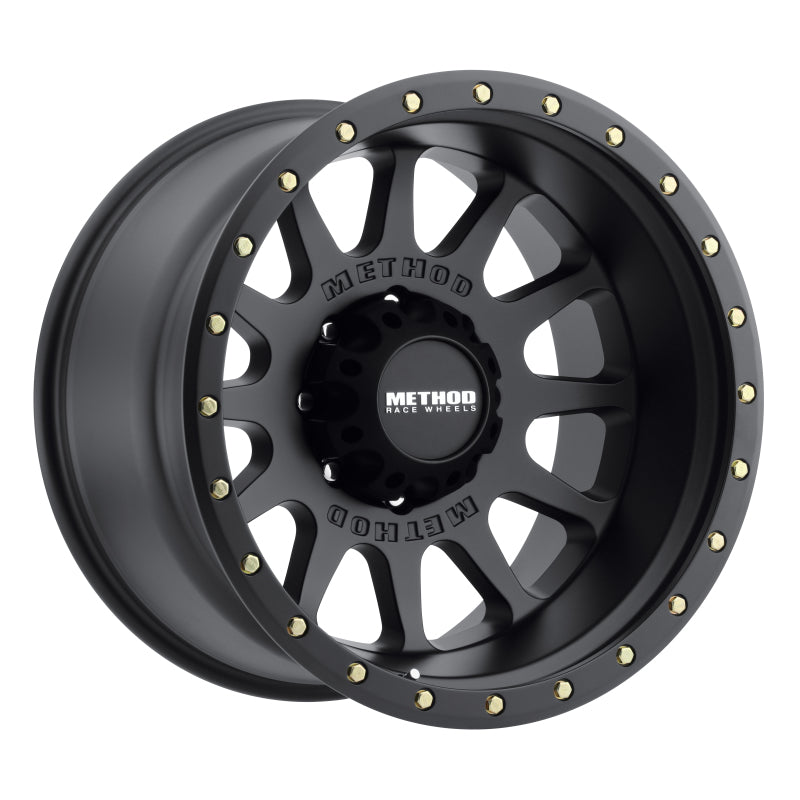 Method Wheels MR605 NV 20x9 wheel featuring a matte black finish and a 12 window design with gold lip bolts.